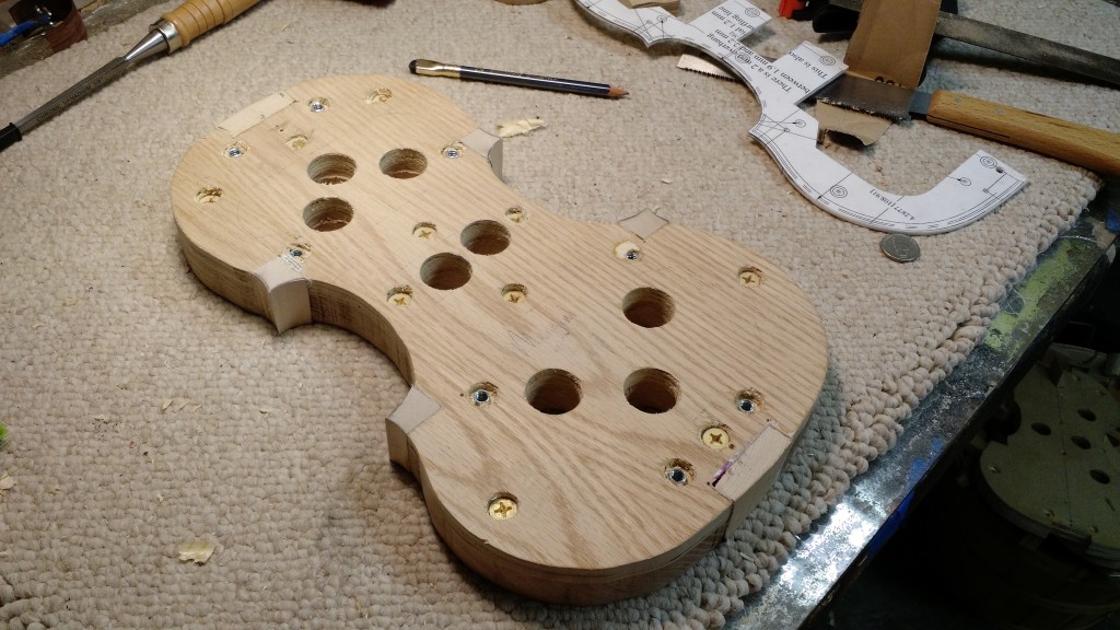 Apply a bandsaw and some work with a file, and voila! We have the outline of a violin!